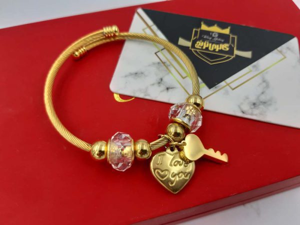 دستبند سیمی با آویز قلب و کلید طلایی