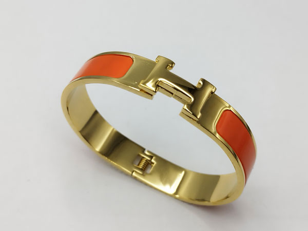 دستبند هرمس طلایی نارنجی استیل